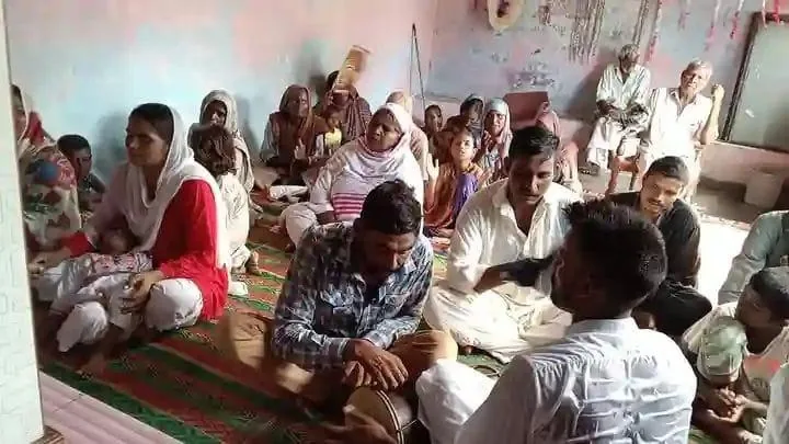 The Pakistani house-church congregation seated together